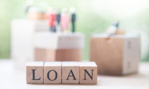 Wood blocks that show the word 'loan'