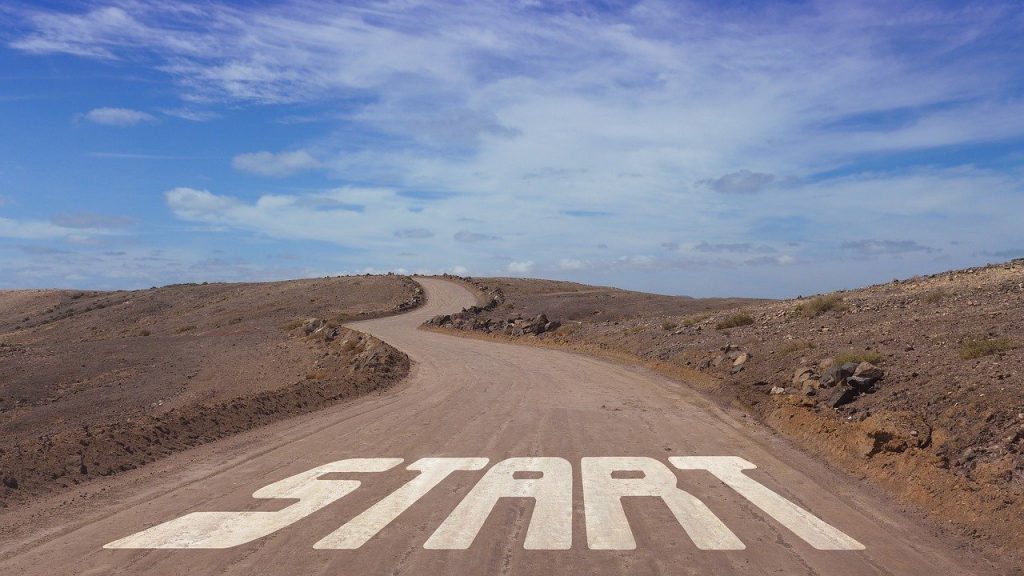 Road with blue sky above and text which says START, representing the concept of starting out with a new customer in your pet sitting business.