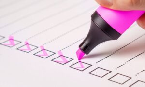 using a highlighter to tick a checklist